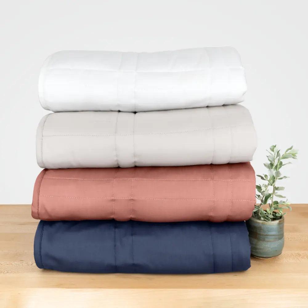 photo of the 4 throws folded and stacked atop each other