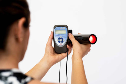 photo of a woman using the biotranducer with the biomodulator pro