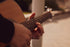 close-up-of-hands-playing-an-acoustic-guitar